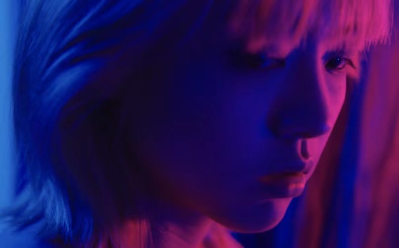A portrait in blue and pink light