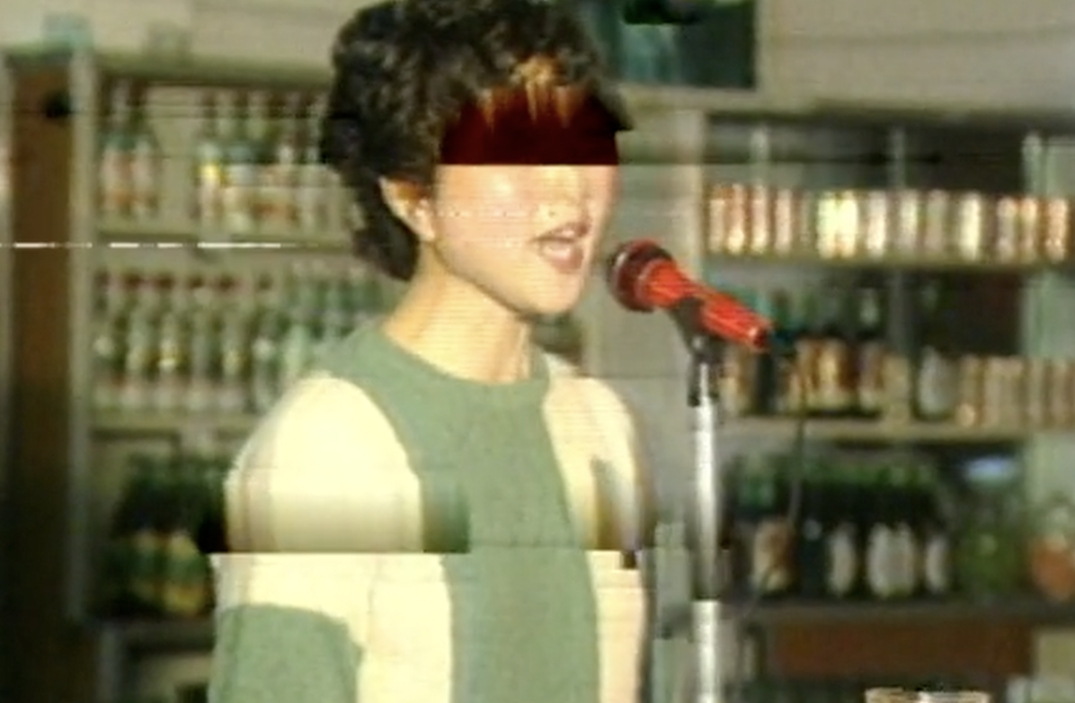 Archival footage of a singer