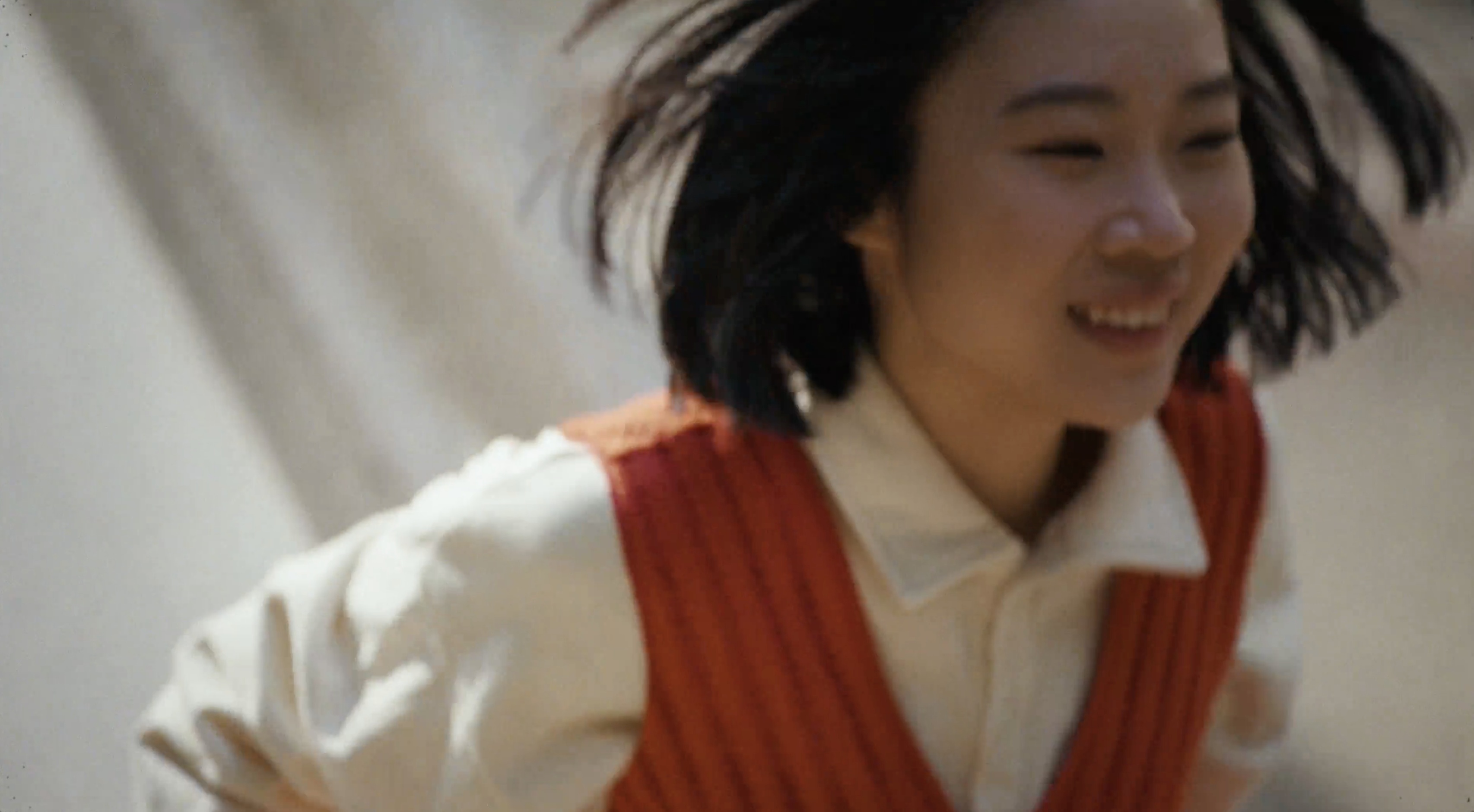 JD — a smiling girl in warm light
