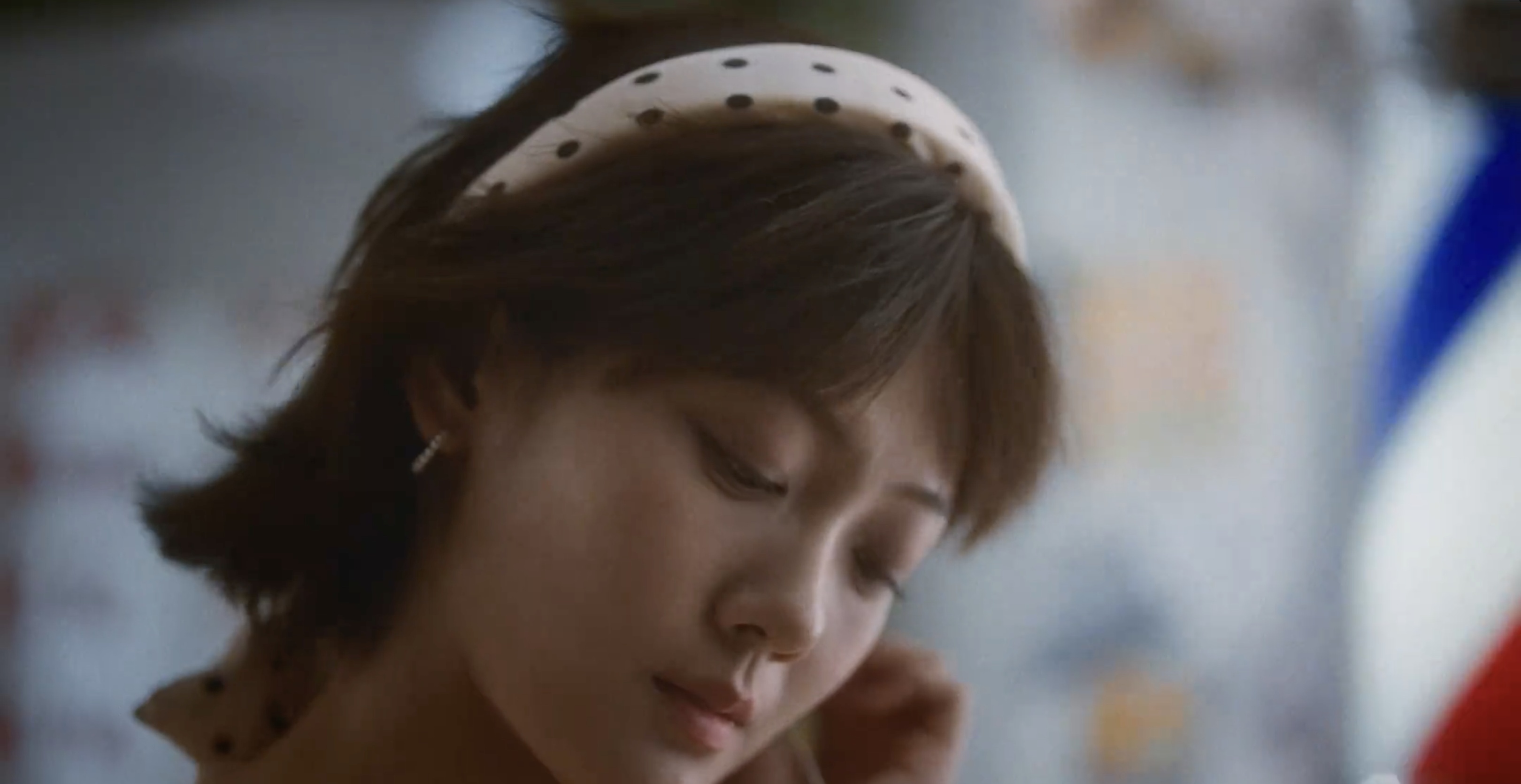 A woman wearing a spotted headband