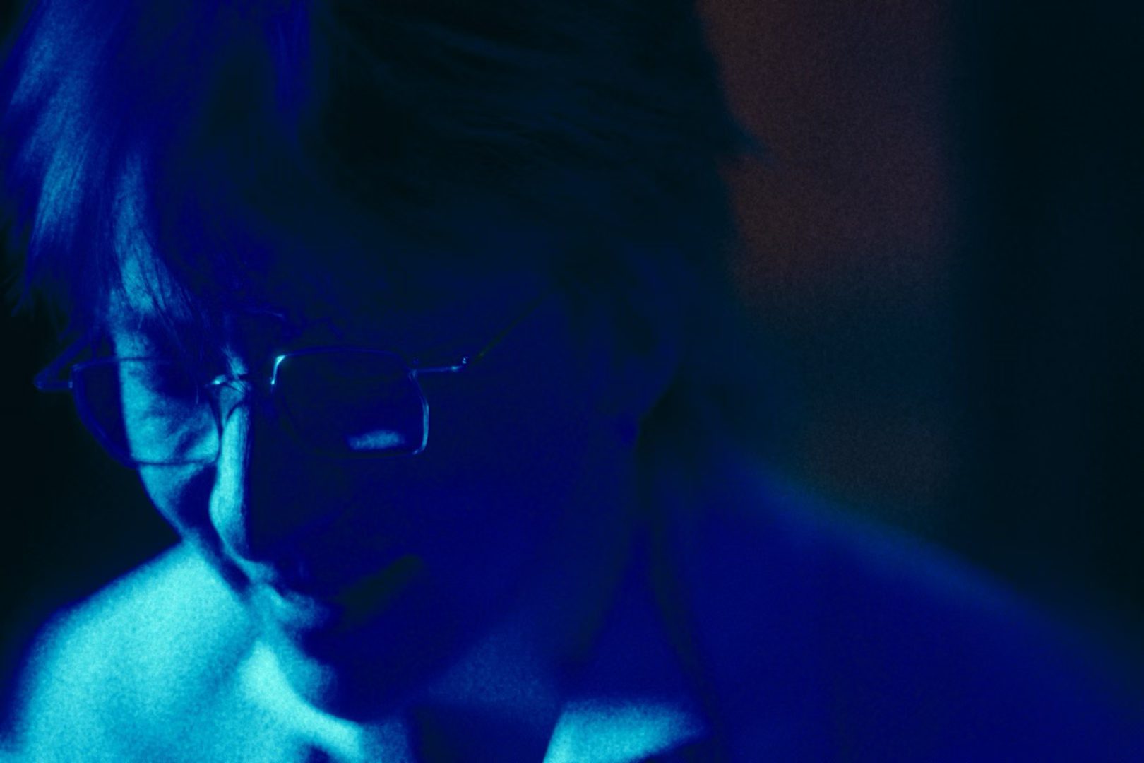 A portrait in deep blue light