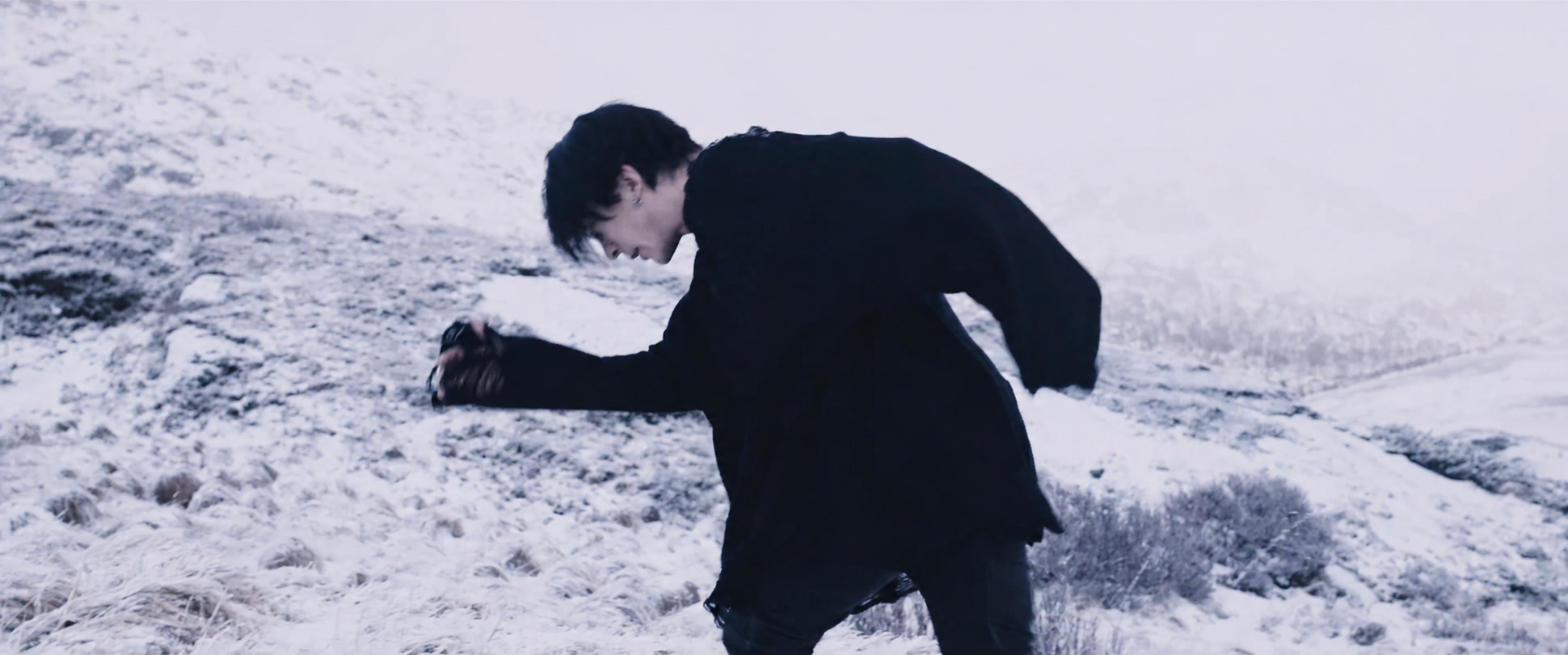 A figure moving across the snow