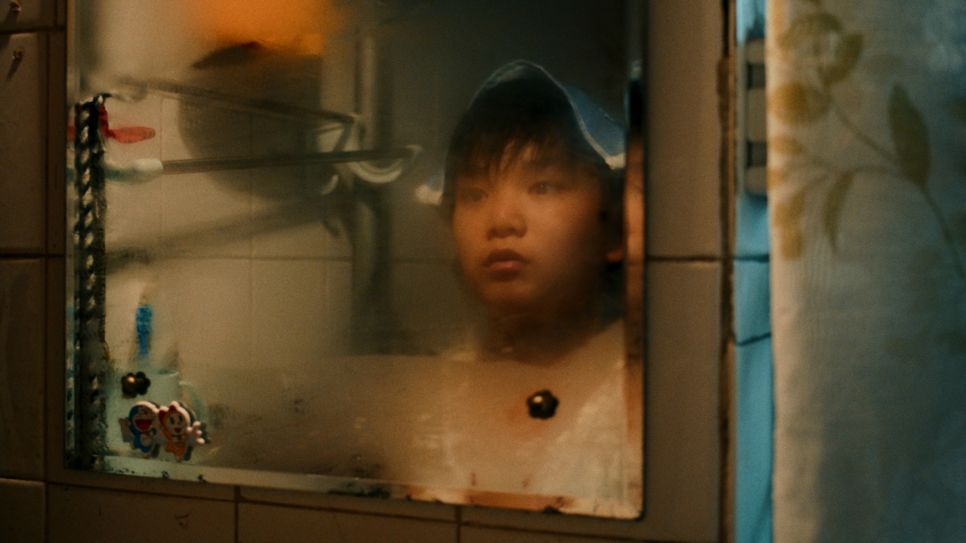A boy reflected in a mirror