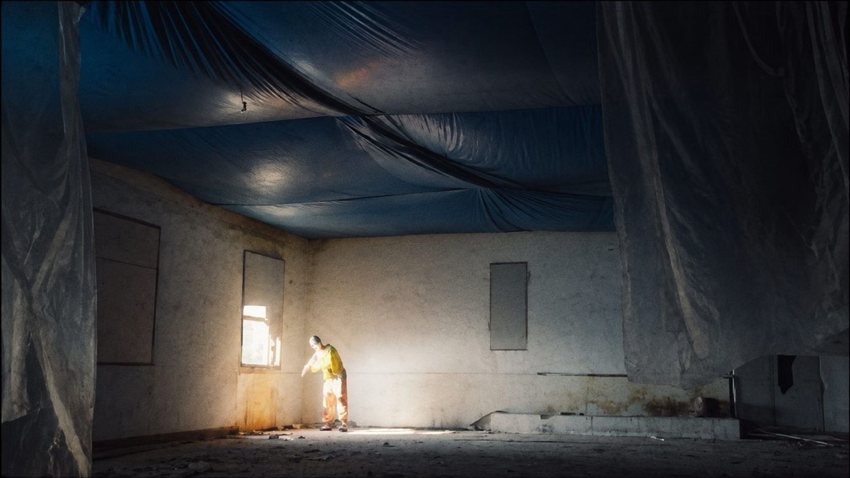 PSYCHOTIC WHISPERY — a clown in a sunlit abandoned room