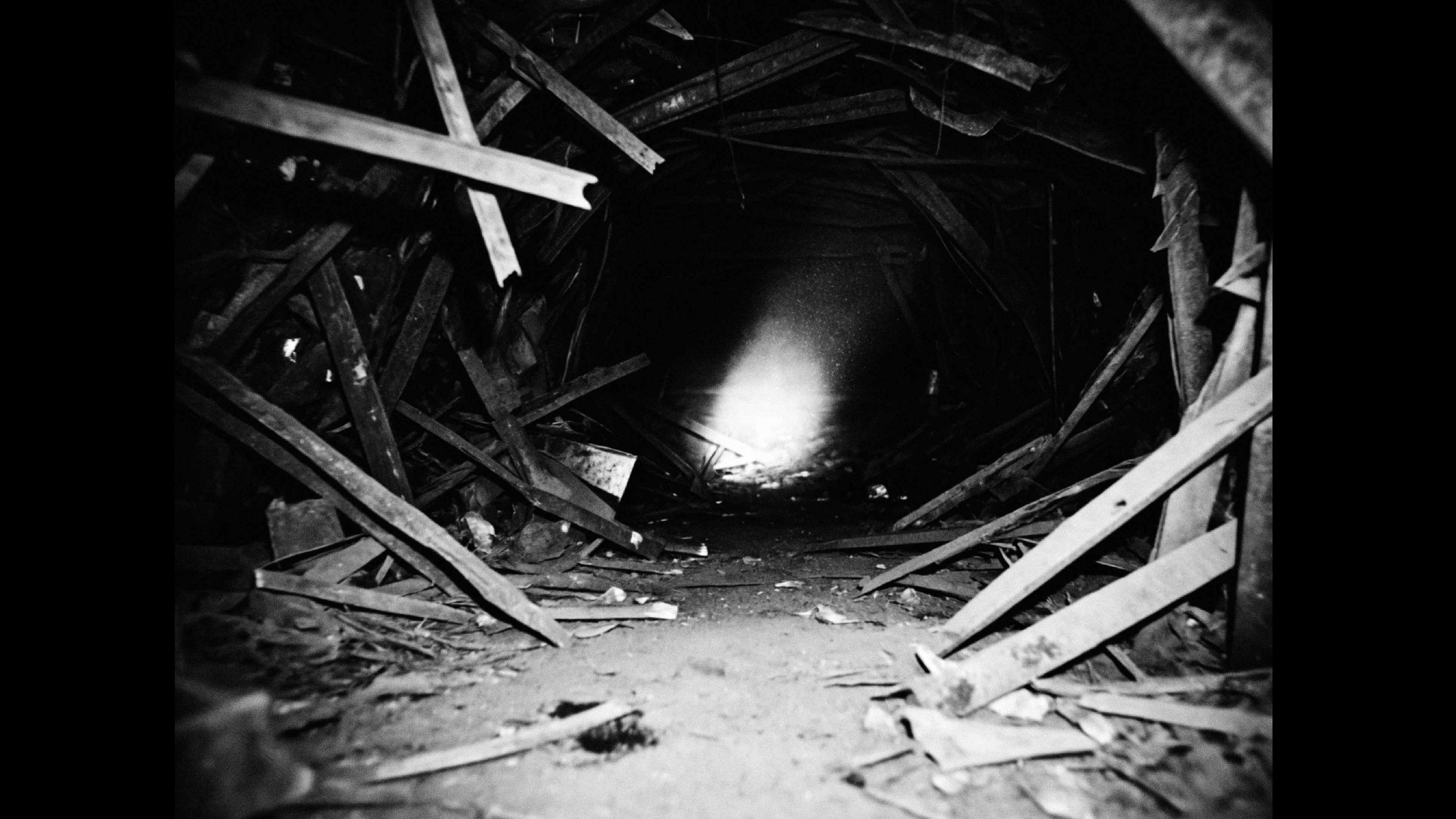 A shaft of light in a scrap-metal tunnel