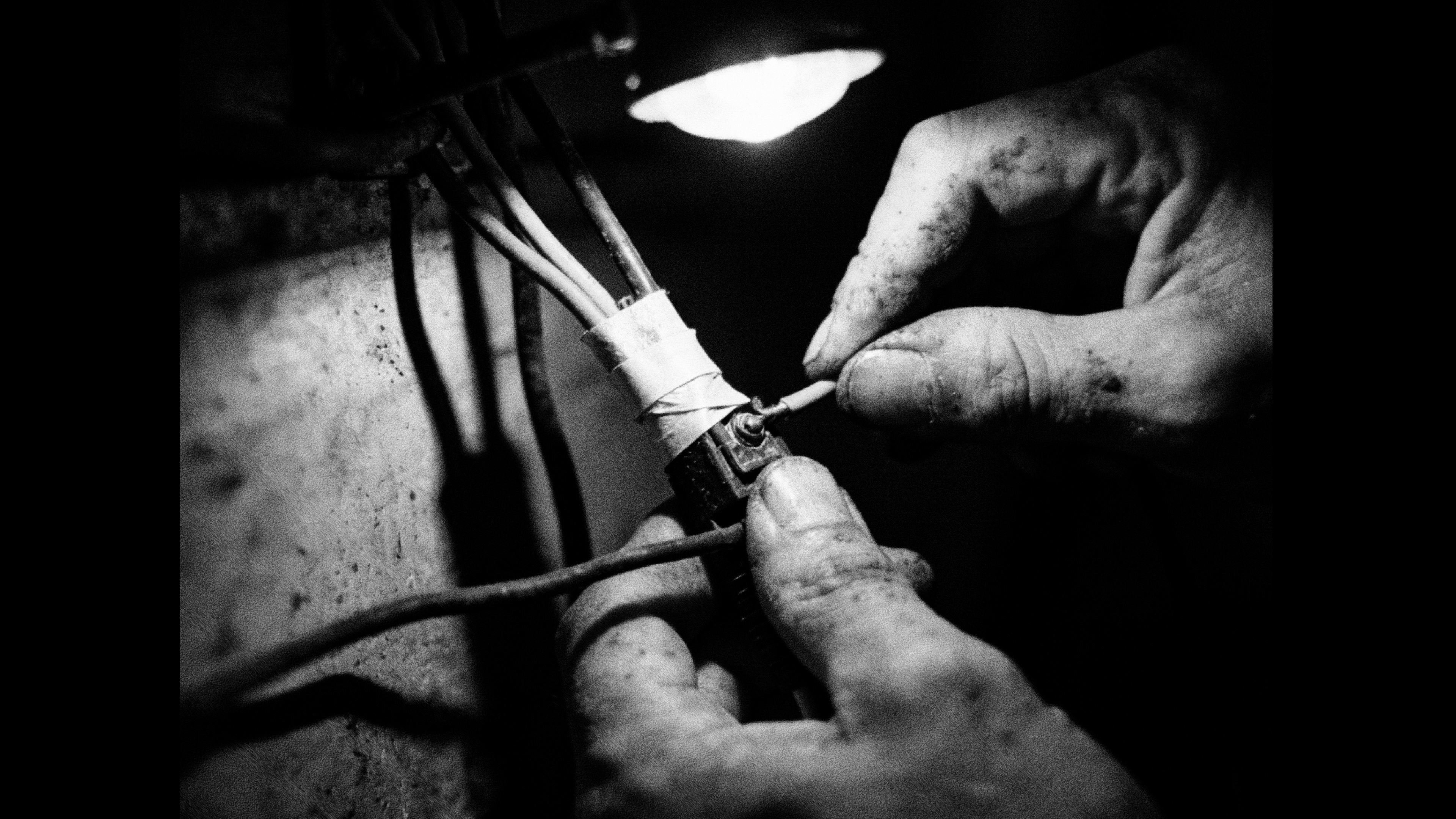 Hands assembling a sound system